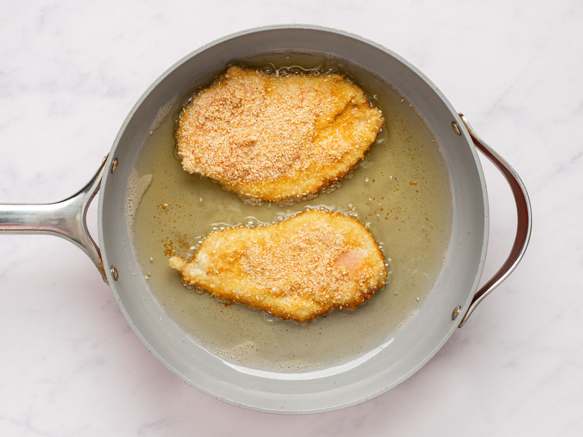 2 pieces of chicken in pan