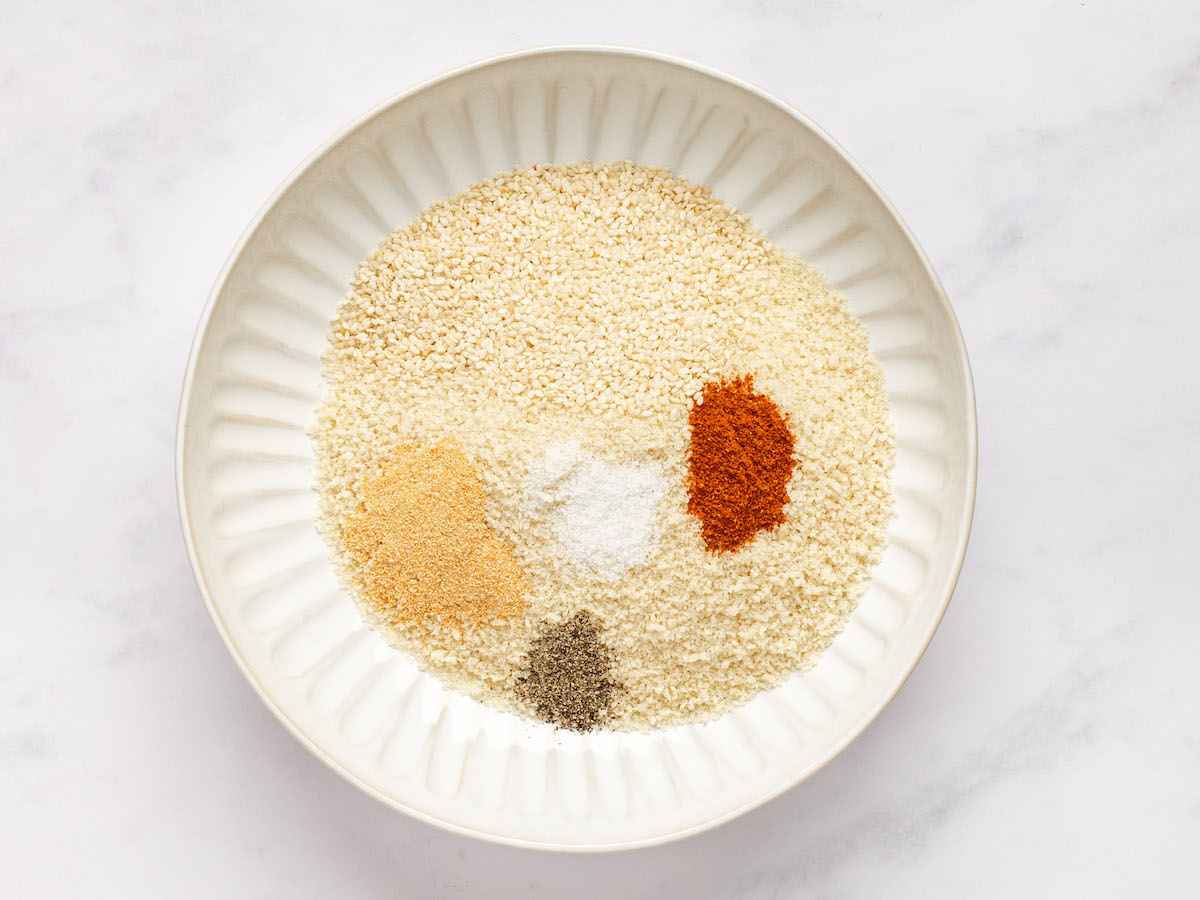 panko, fine sea or table salt, garlic powder, paprika, and sesame seeds in large shallow bowl