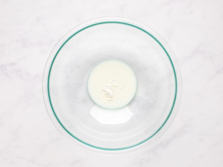 milk and cornstarch in medium bowl