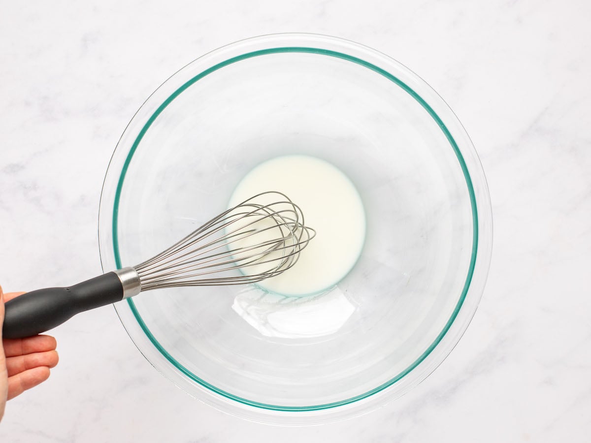 whisking milk and cornstarch in medium bowl