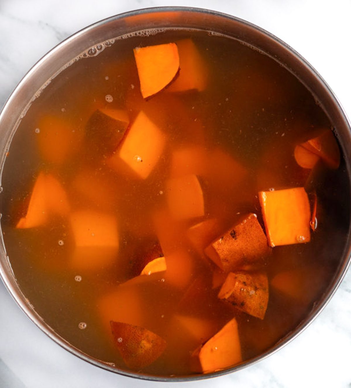 diced sweet potatoes in large pot with water