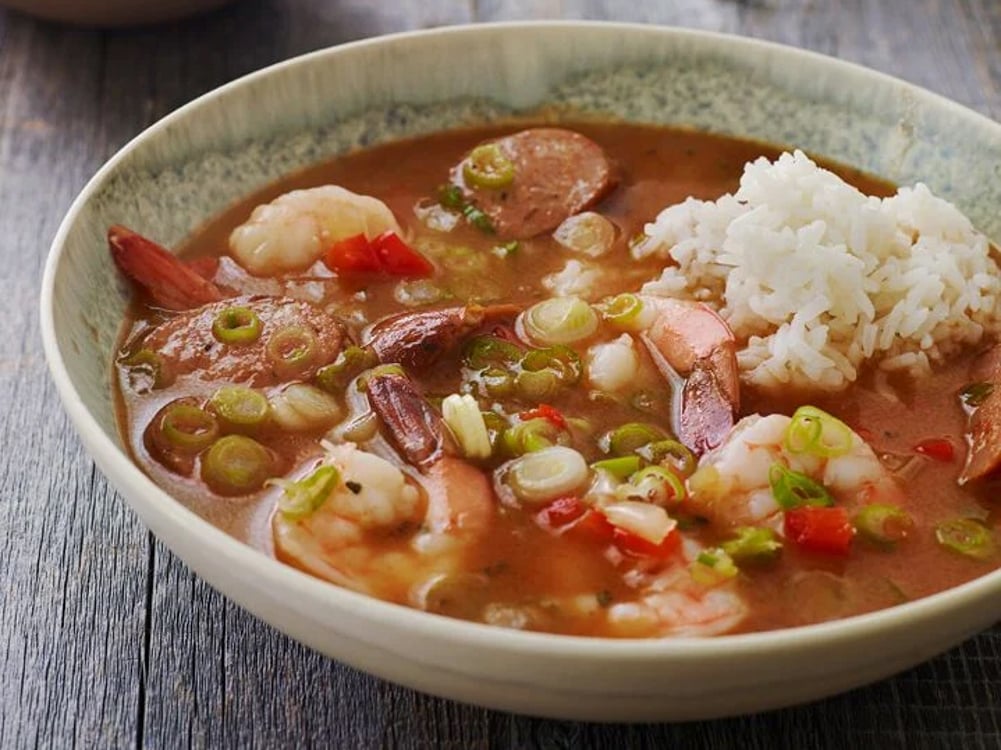 Bowl of gumbo with white rice.