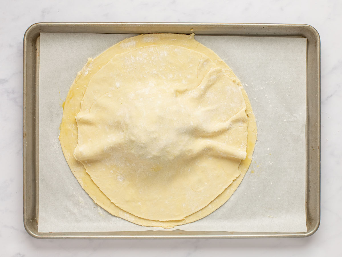 topping the cheese with pastry