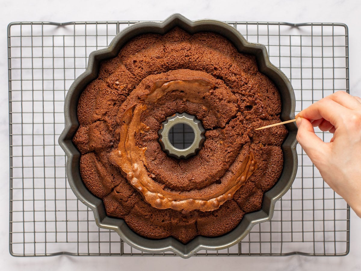 poking holes in cake with toothpick