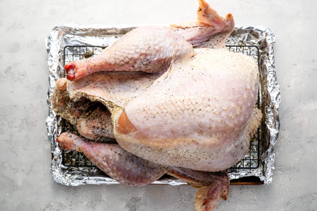 turkey on a wire rack with the dry brine wiped off