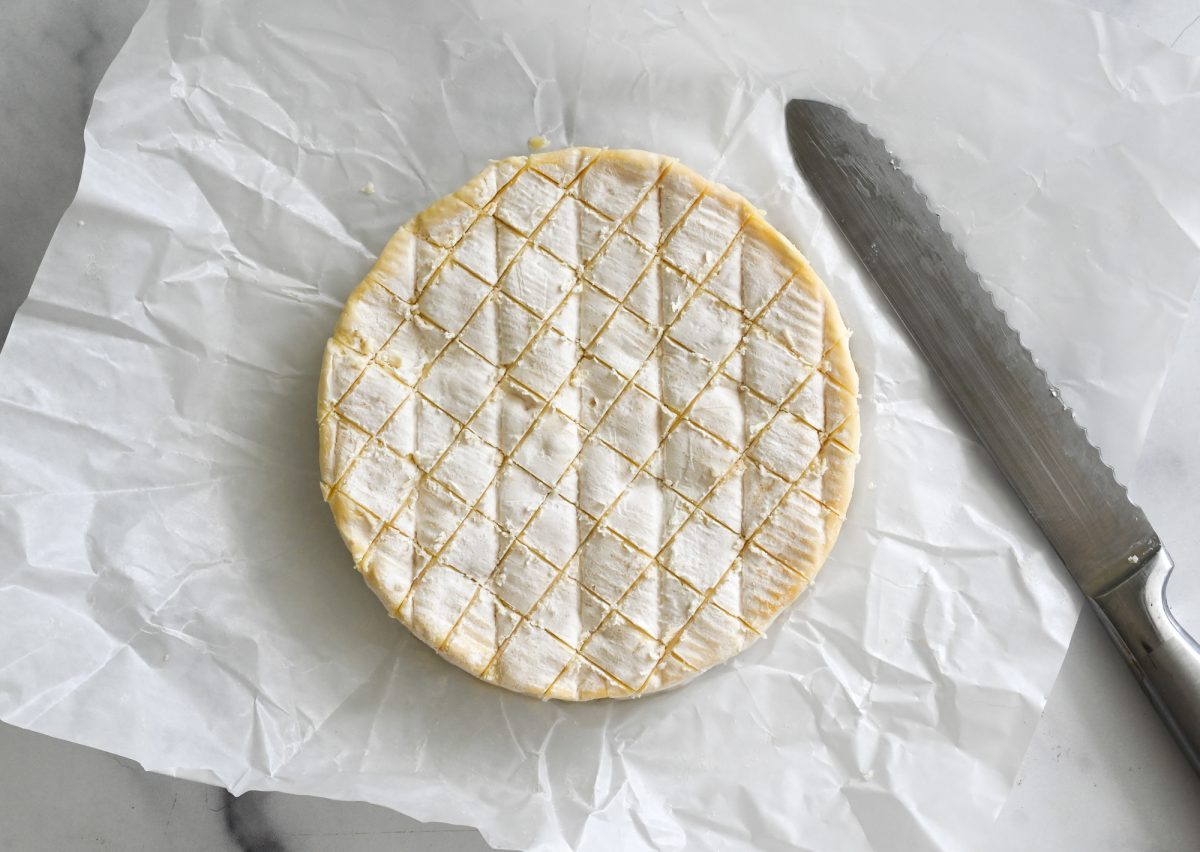 crosshatched brie and knife