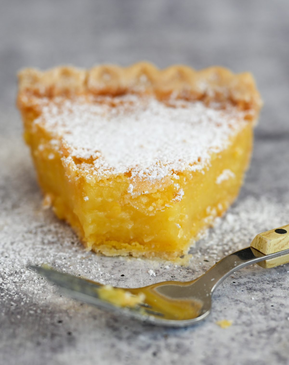 slice of lemon chess pie with fork