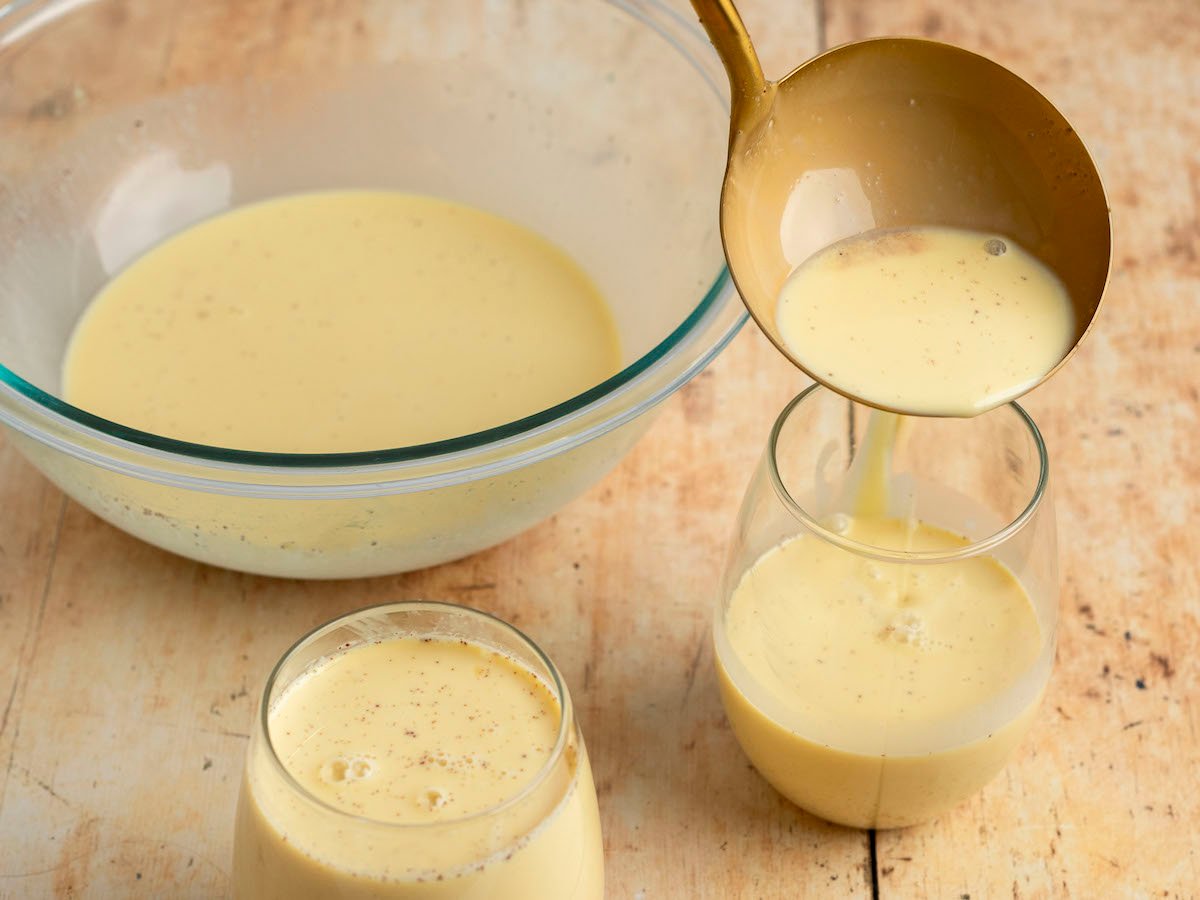 ladling eggnog into glasses