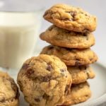 chocolate chip oatmeal cookies on plate with glass of milk