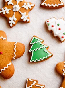 decorated gingerbread cookies on parchment paper.