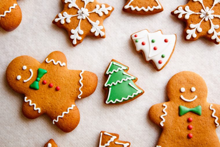decorated gingerbread cookies on parchment paper.
