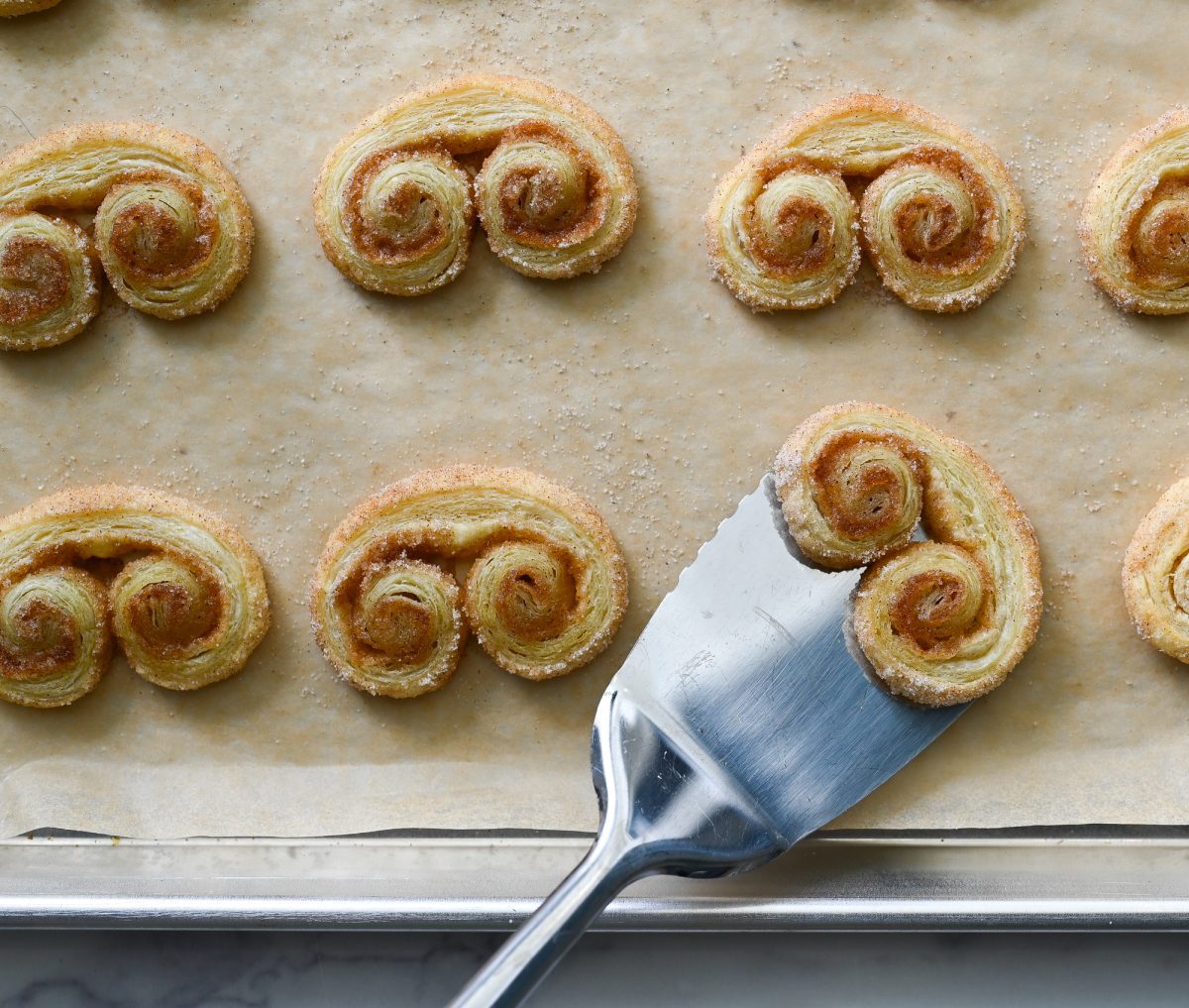 flipping the palmiers partly through cooking