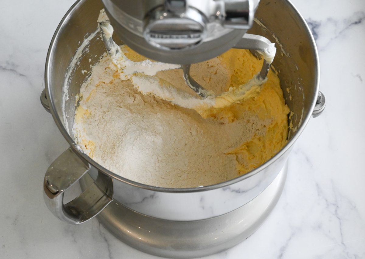 adding the flour to the mixer