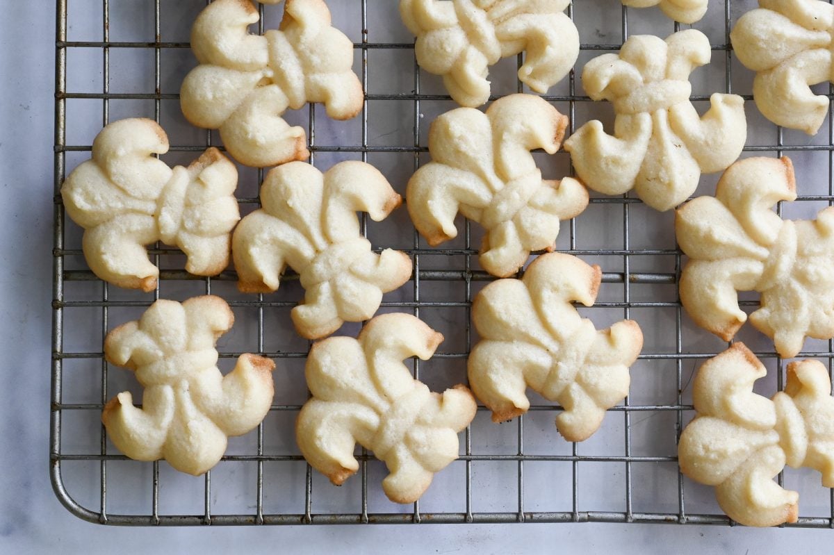 spritz cookies cooling on rack.