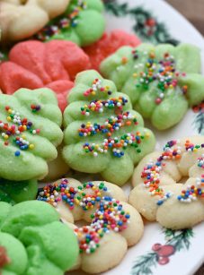 spritz cookies on Christmas plate.