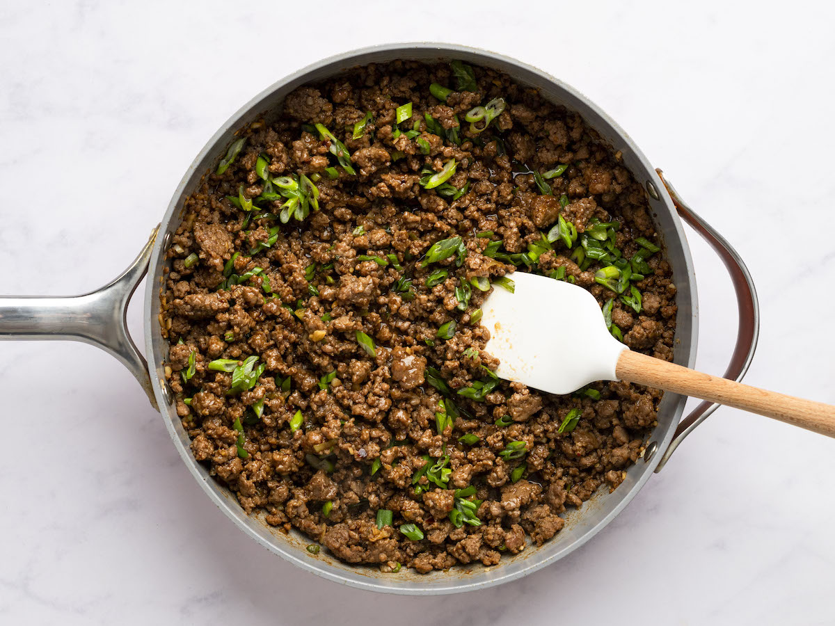 cooked beef mixture with scallions.