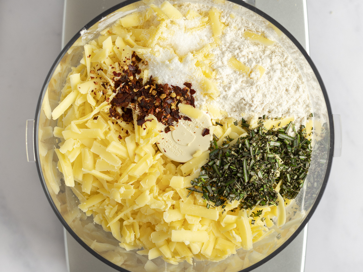 dry ingredients, herbs, pepper flakes, and cheese in food processor.