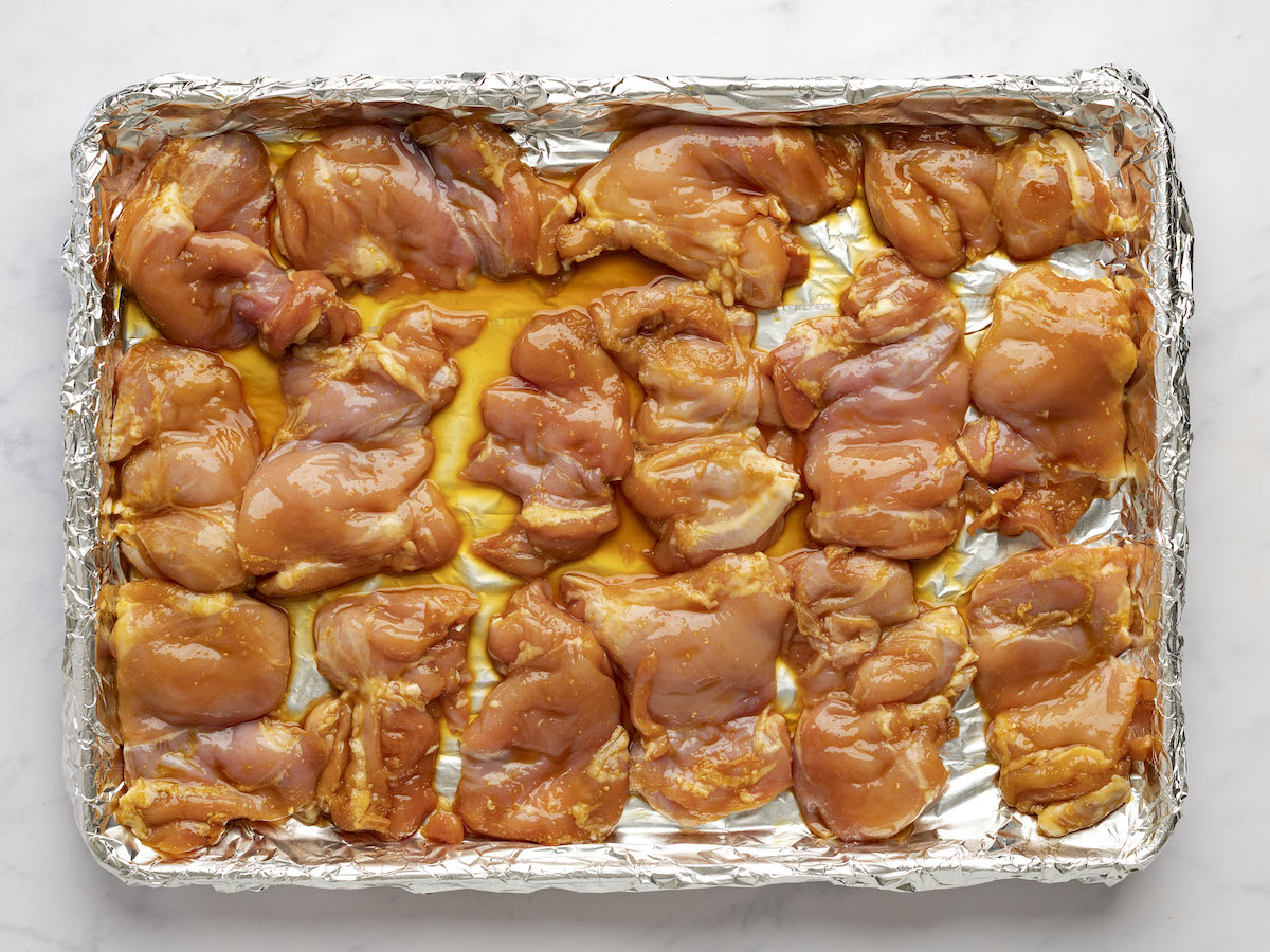 chicken on foil-lined baking sheet ready to broil