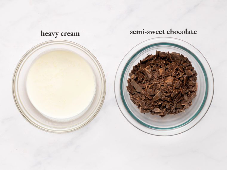Bowls of heavy cream and semi-sweet chocolate.