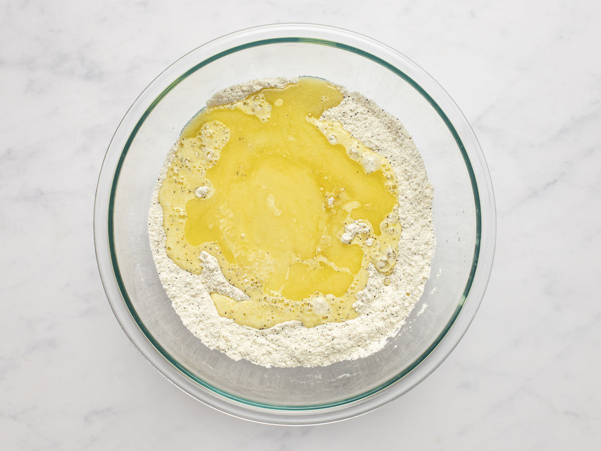 eggs, curdled lemon/mixture and melted butter  added to large bowl with dry ingredients