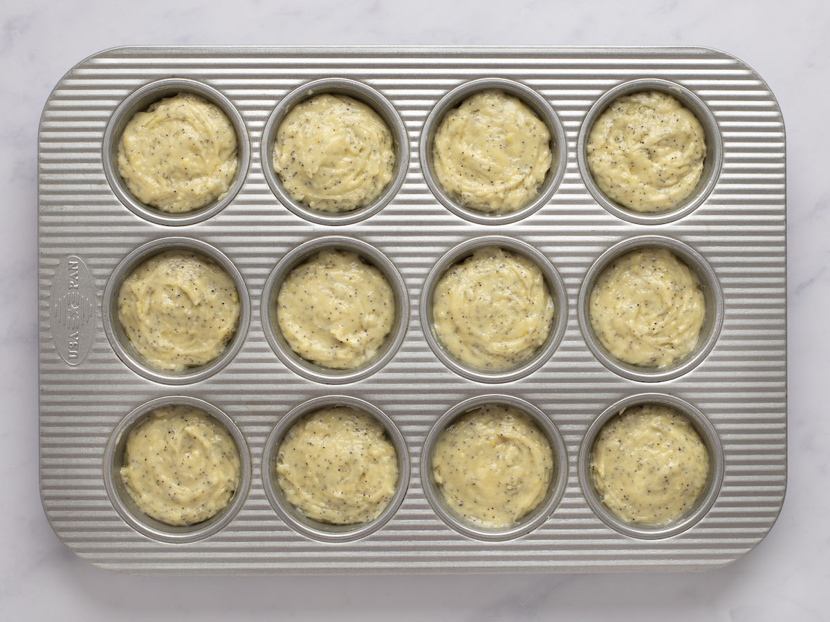 batter divided into standard metal muffin tin