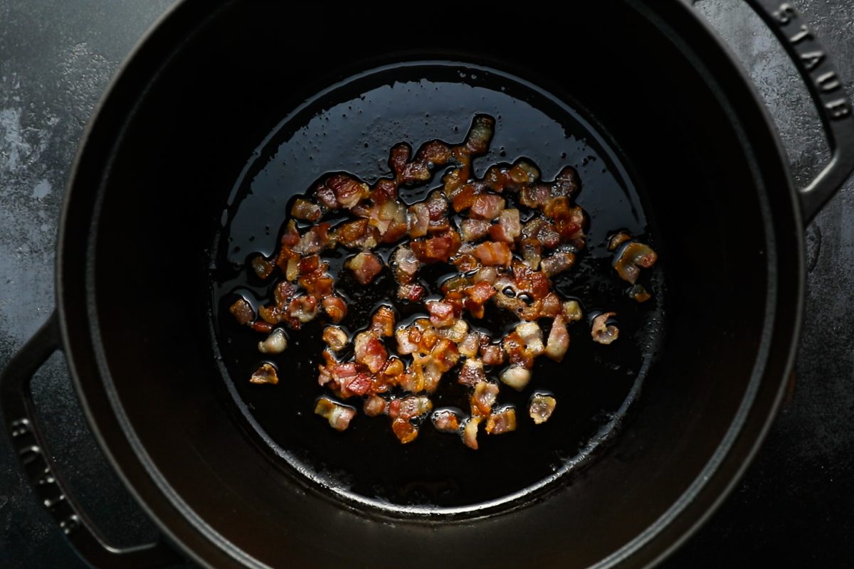 bacon sizzling in pot.