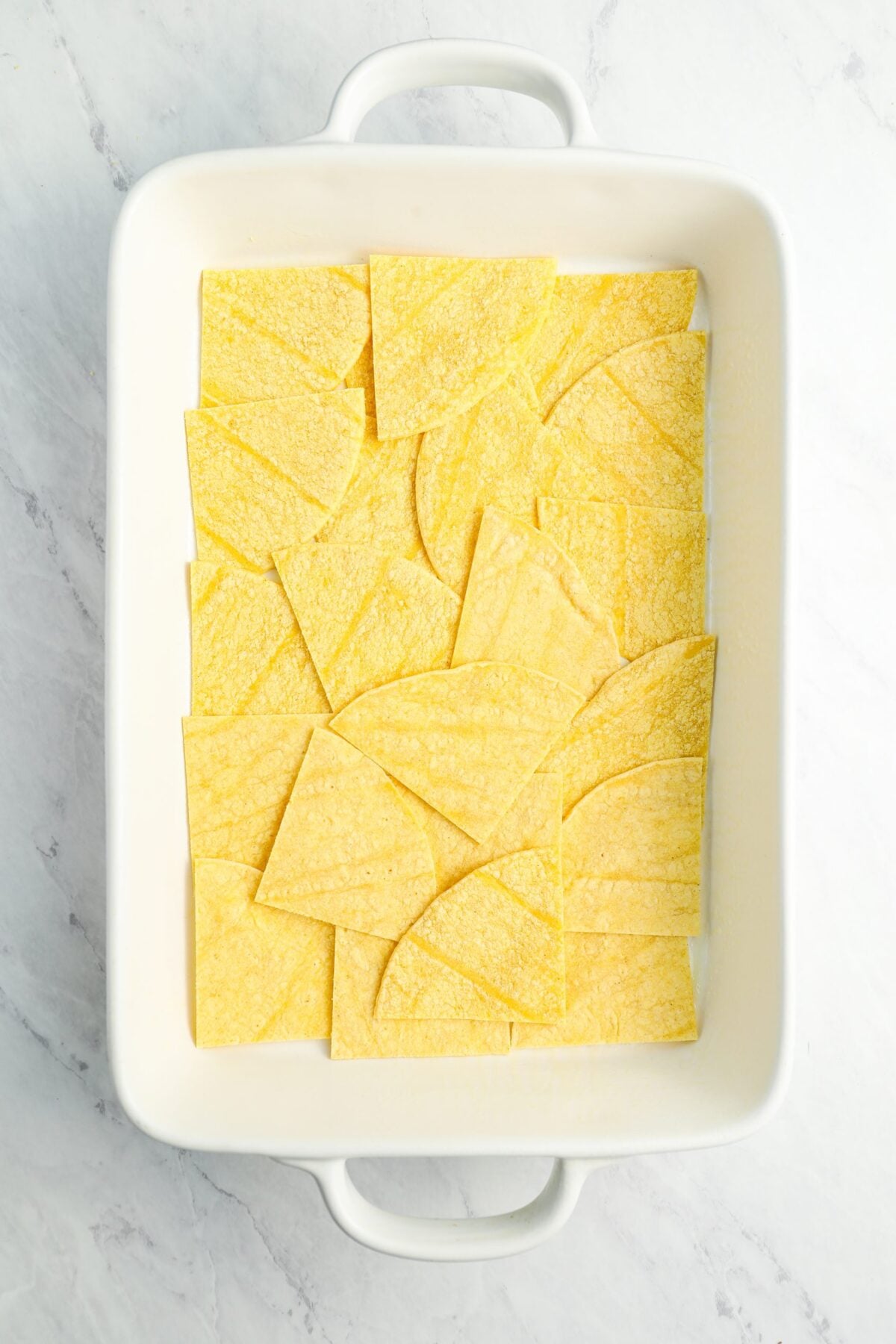 layer of corn tortillas in baking dish.
