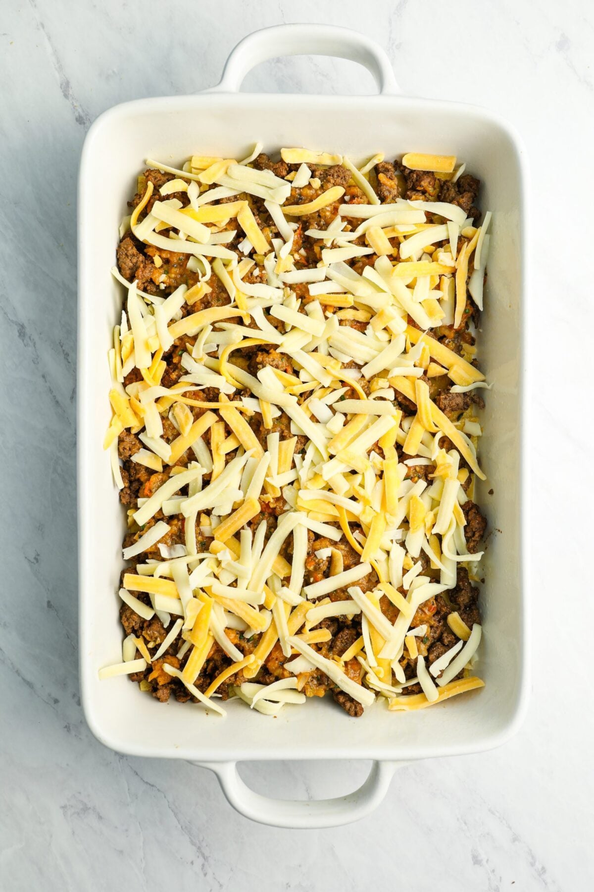 first layer of cheese in baking dish.