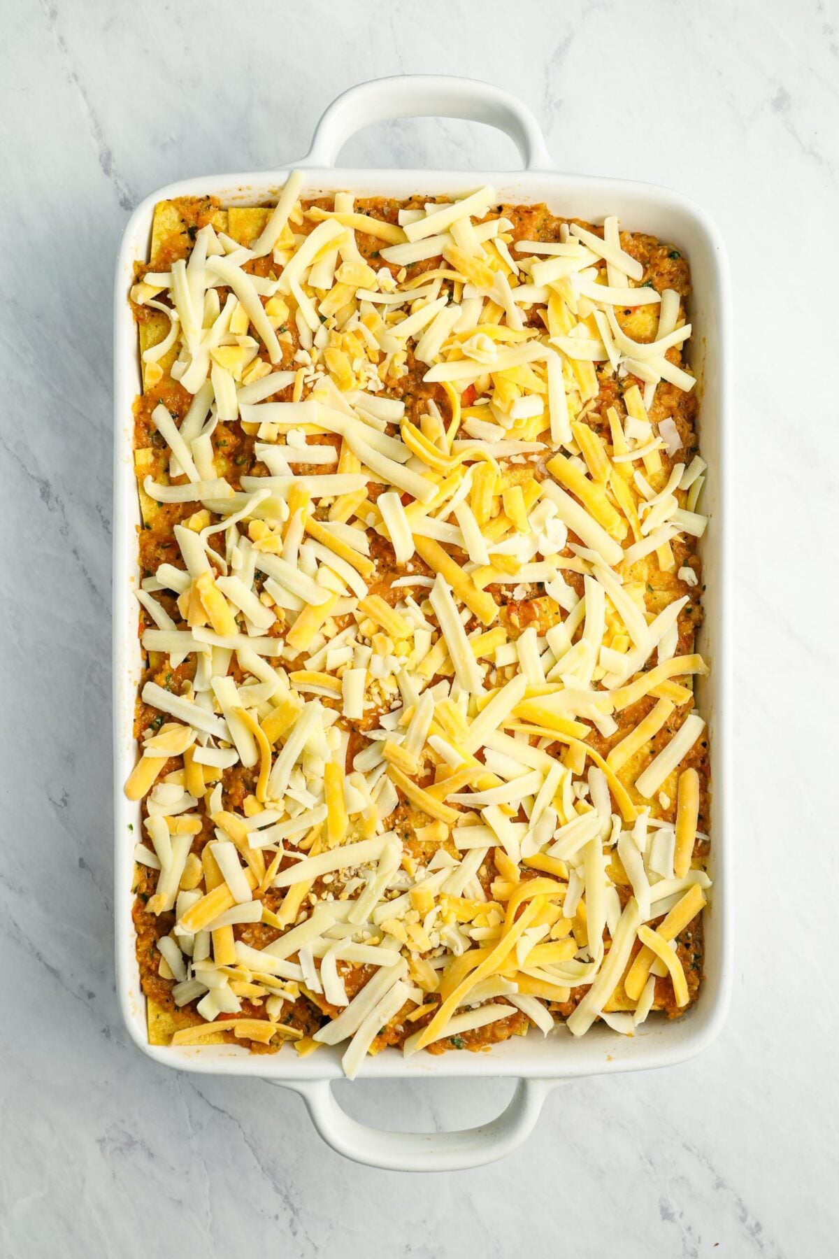 finished stacked enchilada casserole ready to bake.