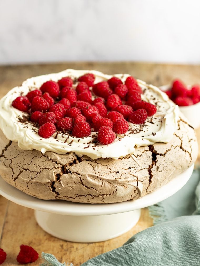 chocolate pavlova with cream and raspberries