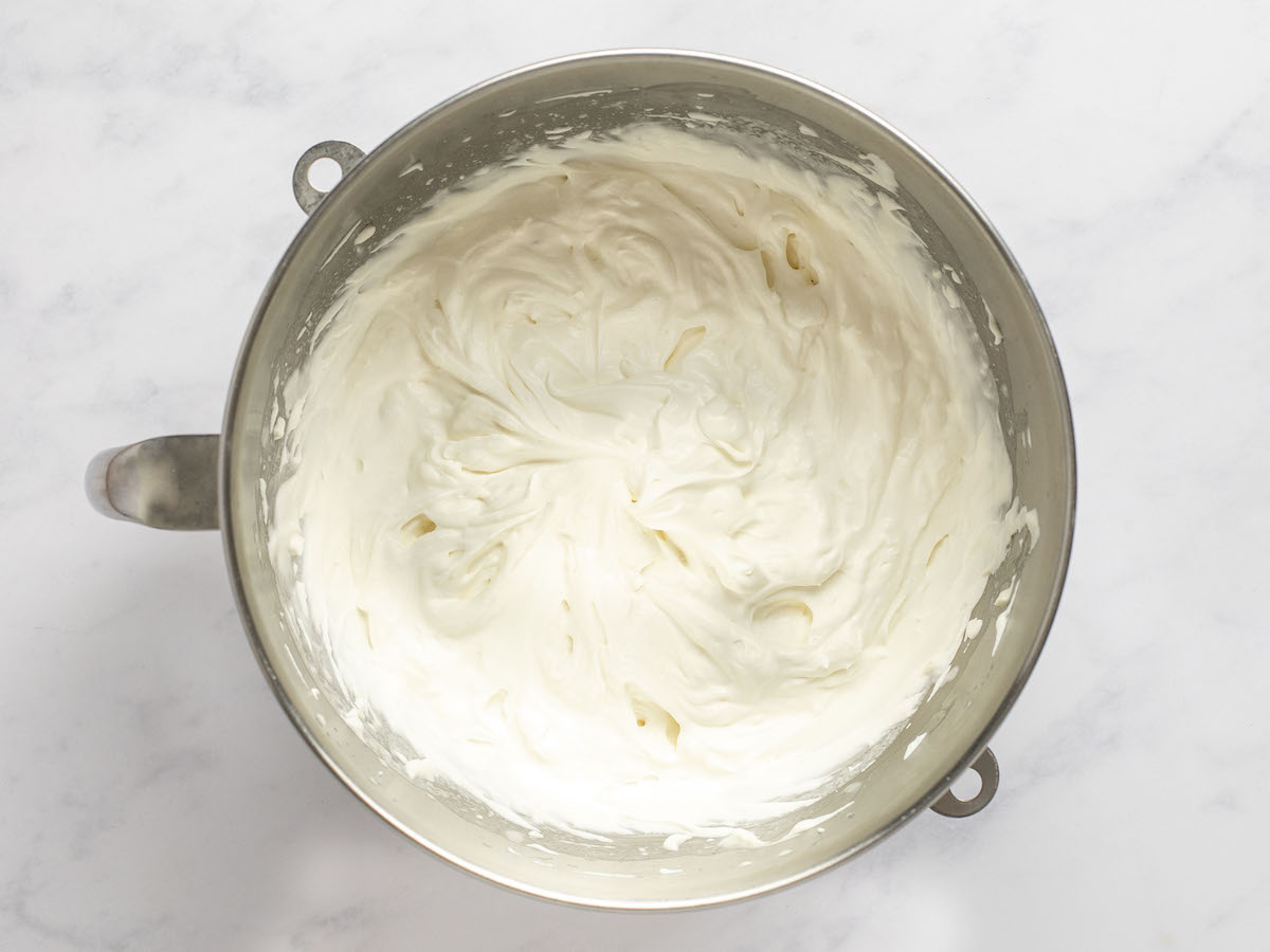 mascarpone cheese, heavy cream, sugar, vanilla, and lemon zest whisked into medium-stiff peaks