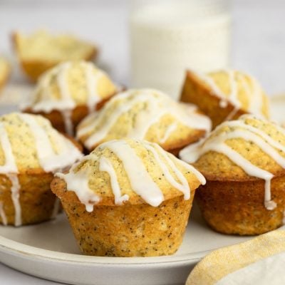 lemon muffins on platter with yellow and white stripe napkin