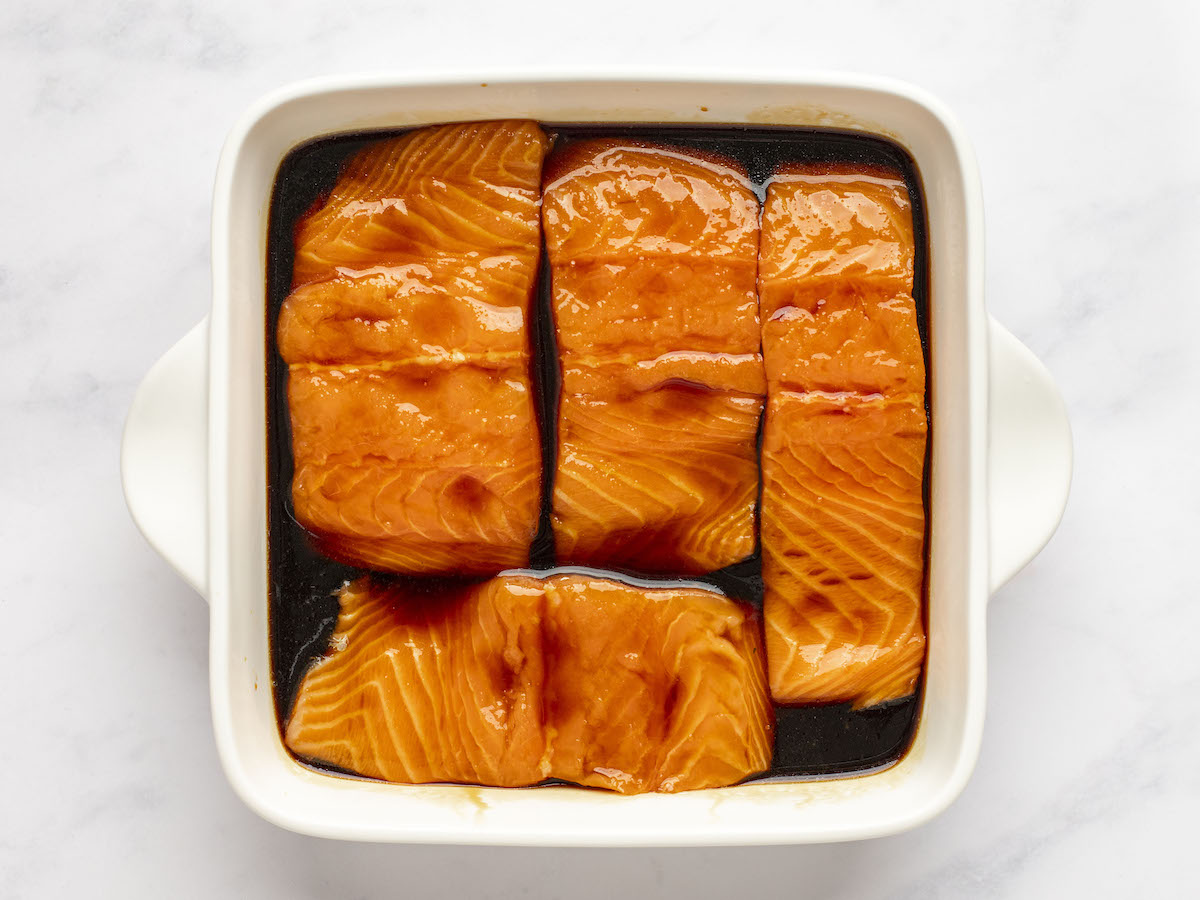 Salmon marinating in teriyaki sauce