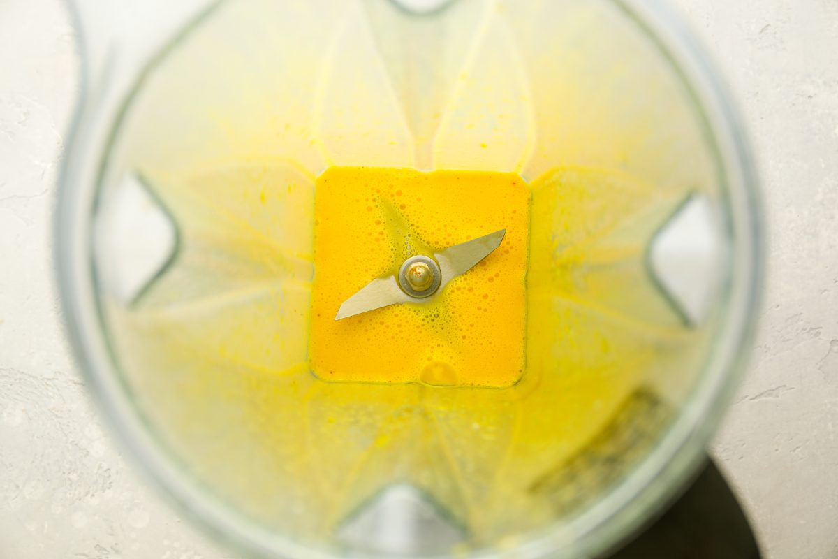 egg yolks, salt, lemon juice, and cayenne pepper in a blender beaten until frothy 