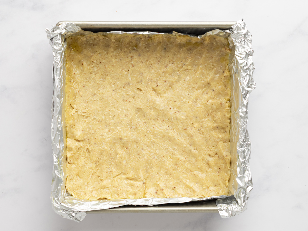 dough pressed into foil-lined pan.