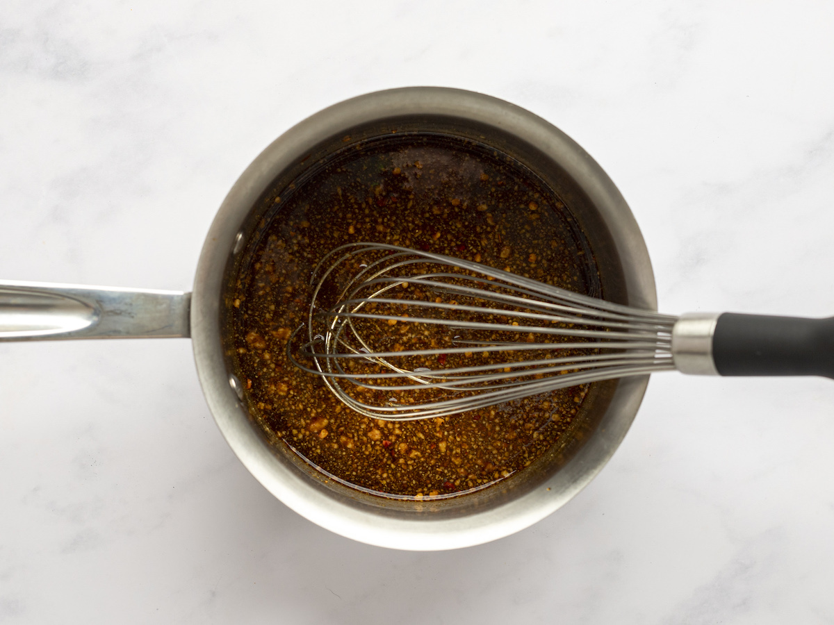 whisked soy mustard glaze in saucepan with whisk.