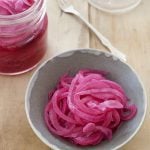 bowl and jar of pickled red onions