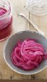 bowl and jar of pickled red onions