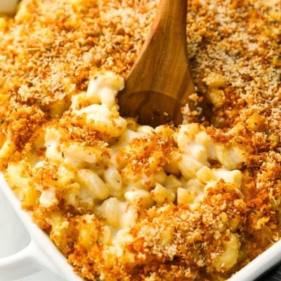 mac and cheese in baking dish with serving spoon