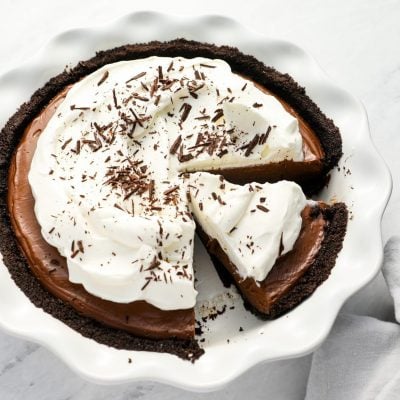 sliced chocolate cream pie with linen napkin