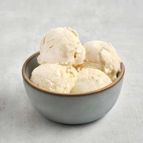 4 scoops of vanilla ice cream in blue bowl