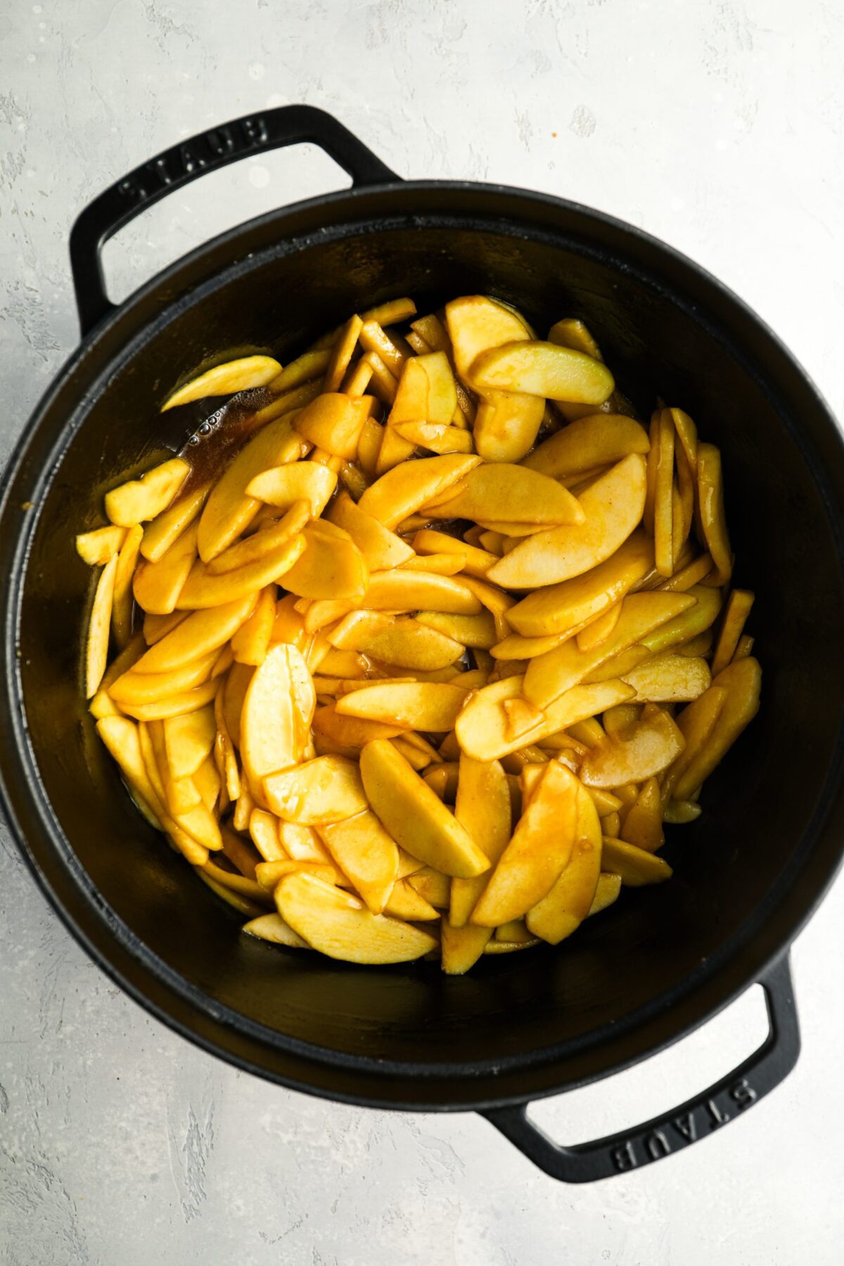 cooked sliced apples in Dutch oven