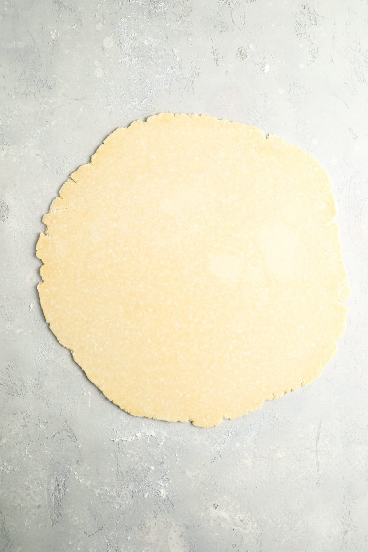 larger dough ball rolled into 13-inch circle