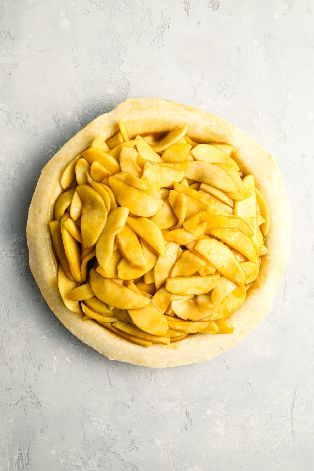 cooked, cooled apples and juice in pie crust
