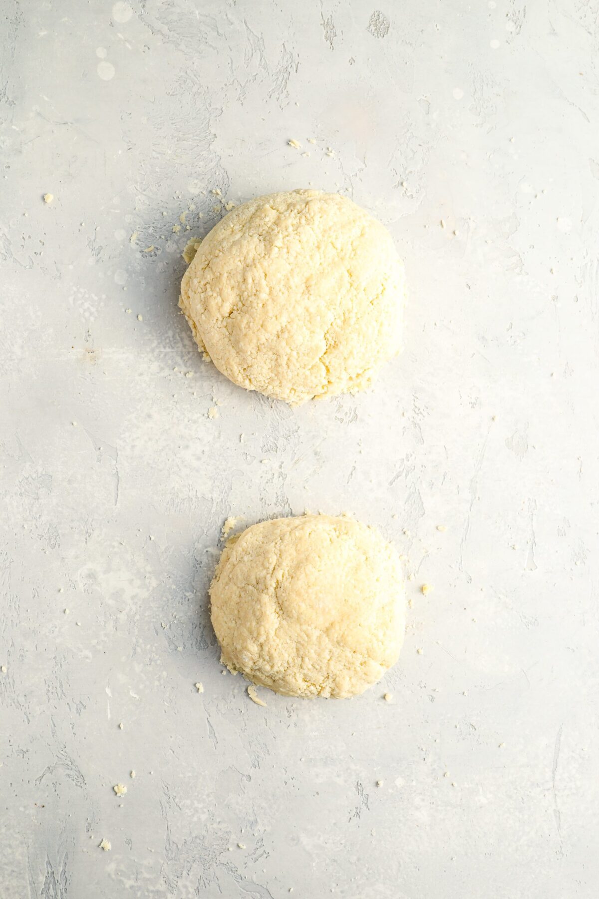 2 dough piles, the left pile slightly bigger than the right pile