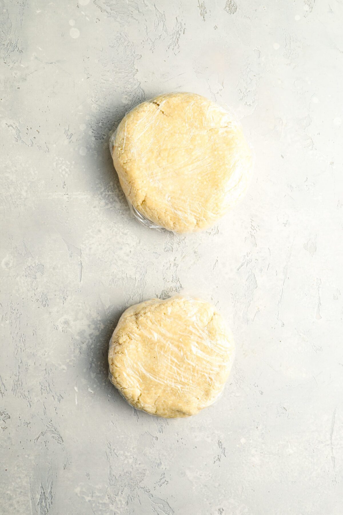 2 dough balls shaped into 5-inch discs