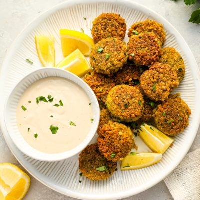 falafel on platter with tahini sauce