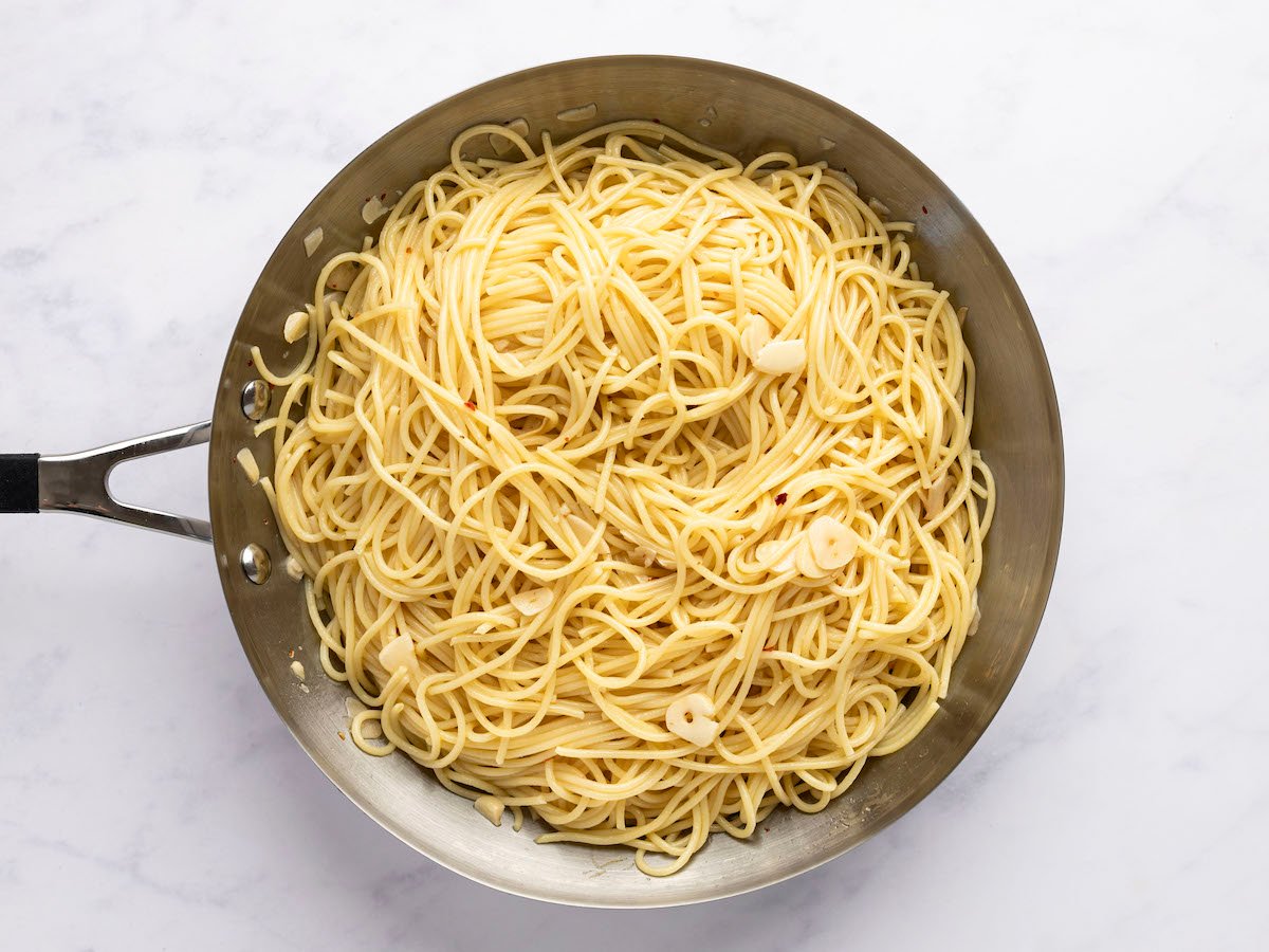 cooked pasta in skillet with cooking water absorbed