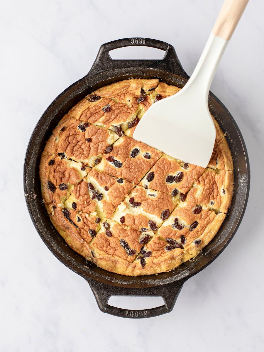 spatula breaking pieces of baked kaiserschmarrn into pieces