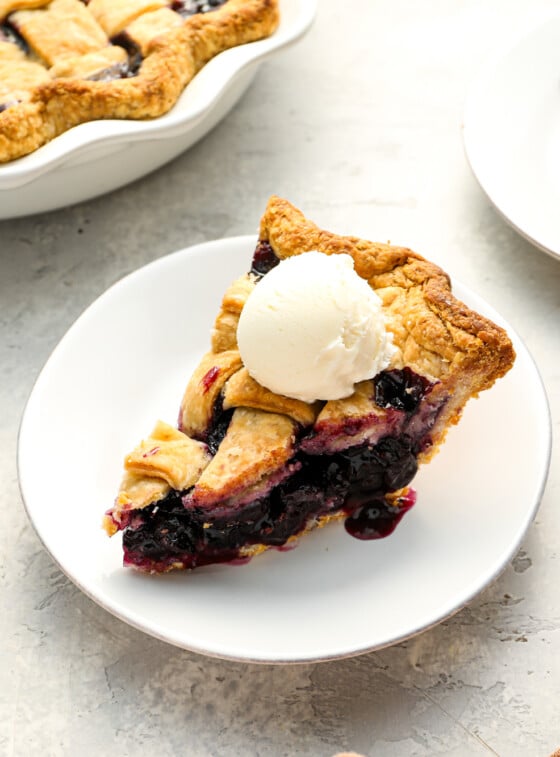 slice of blueberry pie with vanilla ice cream